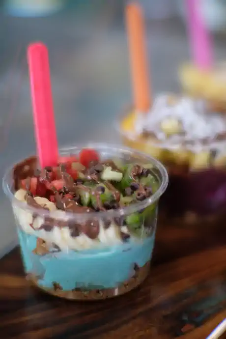 A finished Magic Smoothies açaí bowl piled with fresh fruit